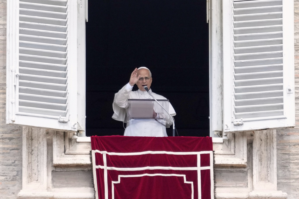 Pope Leo XIV delivers the Angelus prayer in St. Peter's Square at the Vatican, Sunday, Aug. 24, 2025. (AP Photo/Gregorio Borgia)