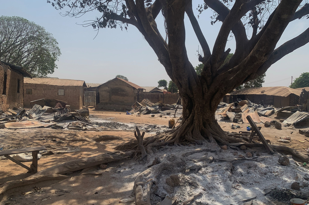 Ashes cover the ground days after an attack on the village of Woro, Nigeria, Thursday, Feb. 5, 2026. (AP Photo/Musa Salim)
