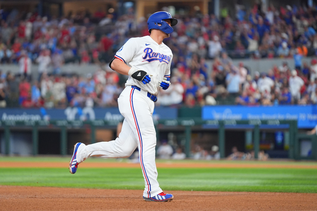 Texas Rangers' Corey Seager runs the bases after hitting a solo home run against the New York Mets during the sixth inning of a baseball game Thursday, Sept. 24, 2026, in Arlington, Texas. (AP Photo/Julio Cortez)