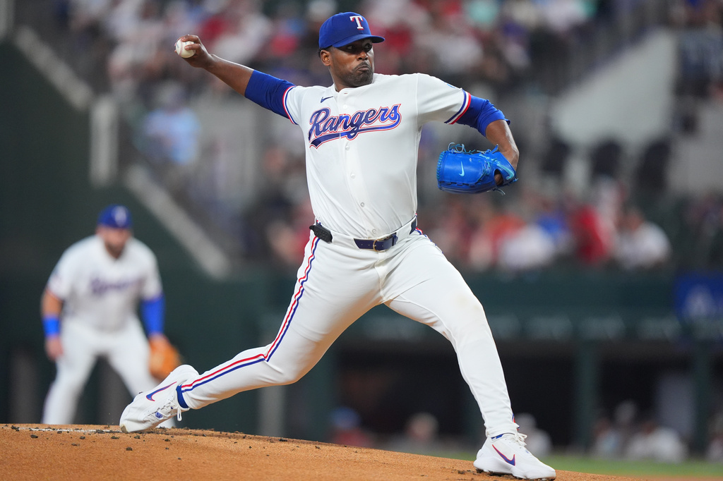 Texas Rangers starting pitcher Kumar Rocker throws during the first inning of a baseball game against the Houston Astros, Saturday, July 11, 2026, in Arlington, Texas. (AP Photo/LM Otero)