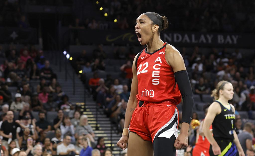 Las Vegas Aces center A'ja Wilson (22) reacts after making a basket against the Dallas Wings during the first half of a WNBA basketball game Sunday, Aug. 17, 2025, in Las Vegas. (Steve Marcus/Las Vegas Sun via AP)