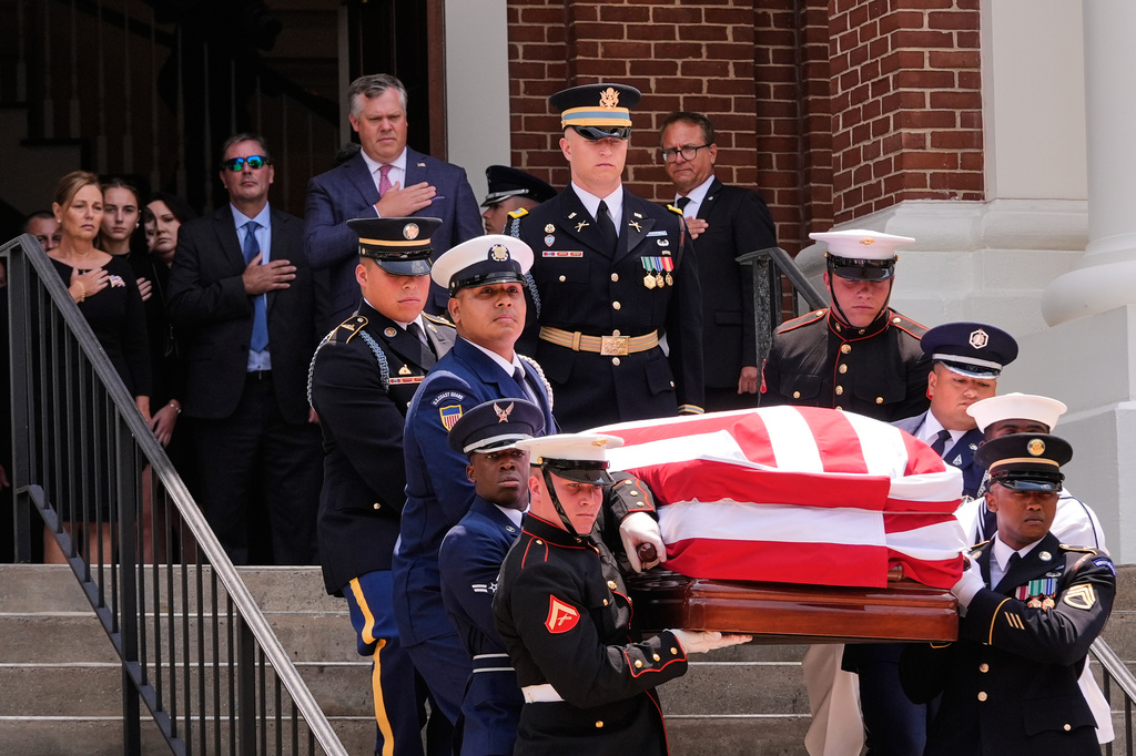 The casket of the late Sen. Lindsey Graham, R-S.C., is carried out of First Baptist Church in Columbia, S.C., following a funeral service, Wednesday, July 29, 2026. (AP Photo/Gerald Herbert)