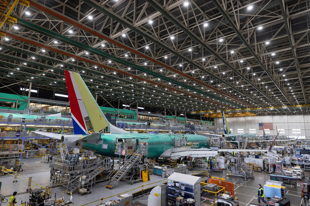 FILE - Boeing employees work on a 737 MAX airplane on the final assembly line at Boeing's plant in Renton, Wash., on June 15, 2022. (Ellen M. Banner/The Seattle Times via AP, Pool, File)