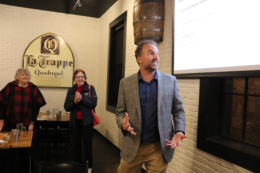 Democrat Eric Gisler talks to supporters about his election victory in a Georgia state House race on Tuesday, Dec. 9, 2025 at the Trappeze Pub in Athens, Ga.. (Christopher Dowd/Athens Political Nerd via AP)