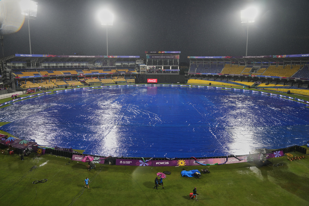 Photo shows the covered field of Premadasa Stadium after the ICC Women's Cricket World Cup match between Australia and Sri Lanka called off due to rain in Colombo, Sri Lanka, on Saturday, October 4, 2025. ( AP Photo/ Eranga Jayawardena)