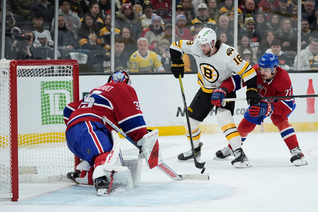 Montreal Canadiens goaltender Samuel Montembeault (35) stops Boston Bruins center Pavel Zacha (18) during the second period of an NHL hockey game in Boston, Saturday, Jan. 24, 2026. (AP Photo/Robert F. Bukaty)