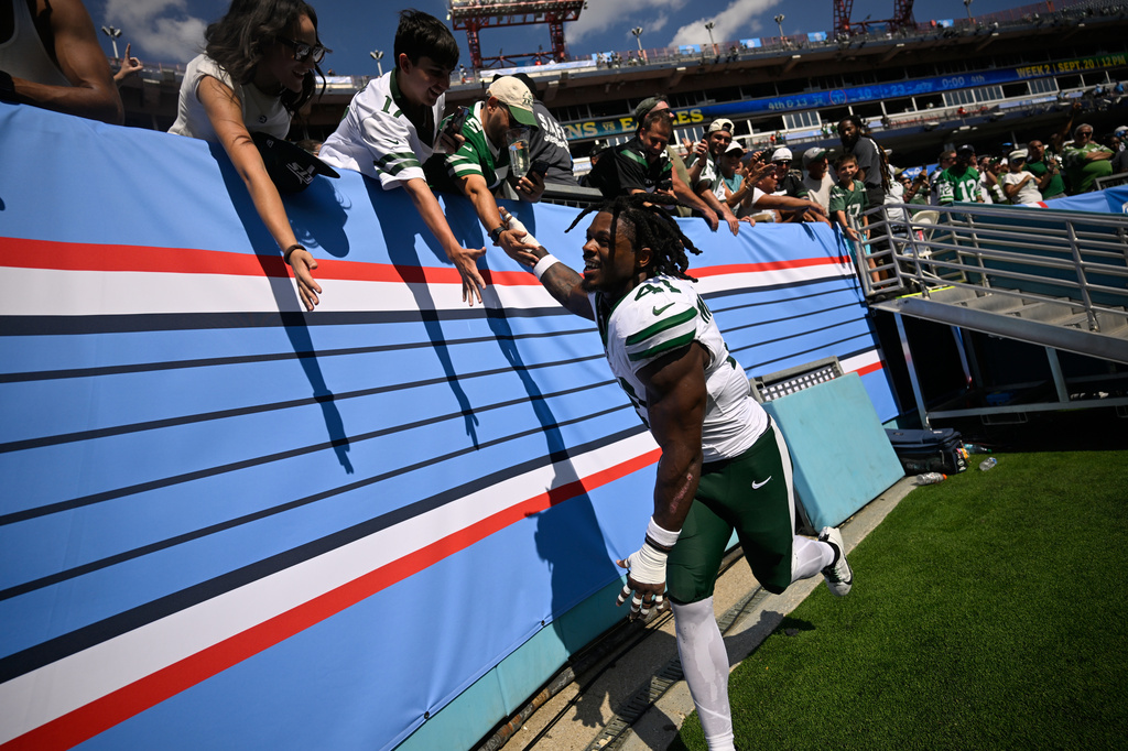New York Jets linebacker Marcelino McCrary-Ball (41) greets fans at the end of an NFL football game against the New York Jets, Sunday, Sept. 13, 2026, in Nashville, Tenn. (AP Photo/John Amis)