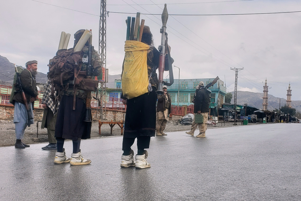 FILE - Taliban fighters stand near the closed Torkham border with Pakistan, where Pakistani and Afghan forces exchanged fire overnight, in Torkham, Afghanistan, Monday, March 3, 2025.(AP Photo/Shafiullah Kakar, file)