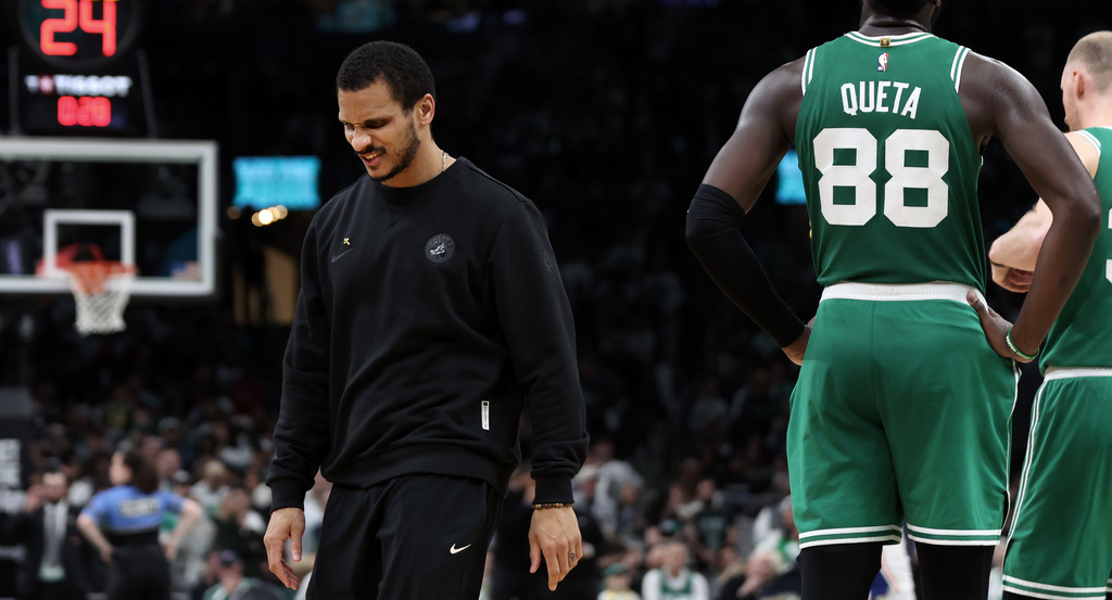 Boston Celtics' head coach Joe Mazzulla, left, is seen during a timeout in the fourth quarter of Game 7 of a first round NBA basketball playoffs series vs. the Philadelphia 76ers, Saturday, May 2, 2026 in Boston. (AP Photo/Jim Davis)