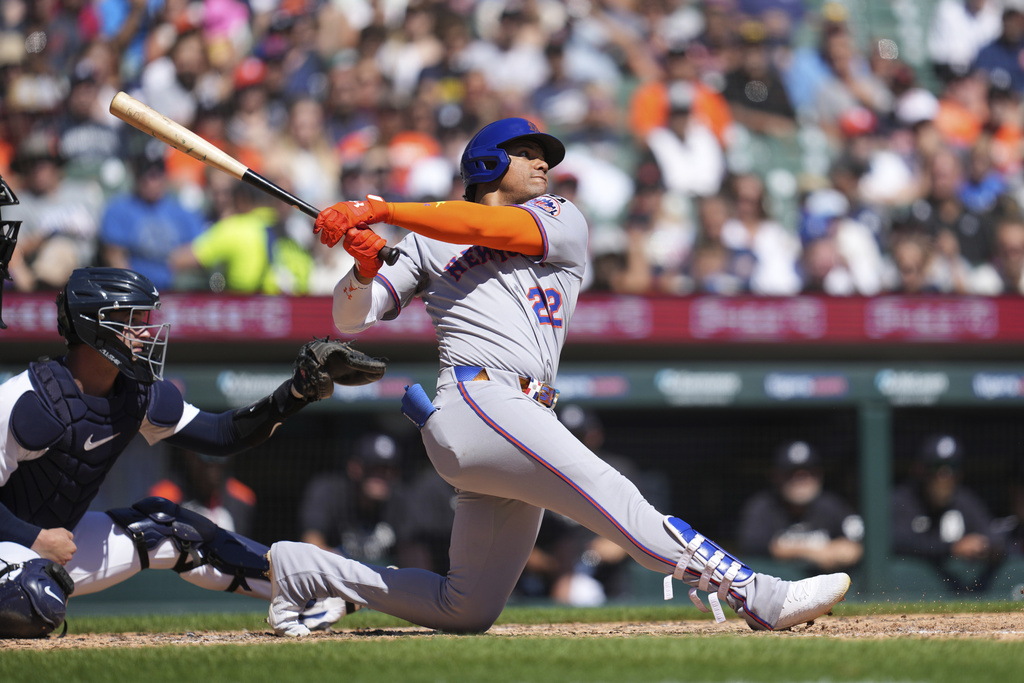 New York Mets outfielder Juan Soto hits a grand slam against the Detroit Tigers in the fourth inning during a baseball game Monday, Sept. 1, 2025, in Detroit. (AP Photo/Paul Sancya)