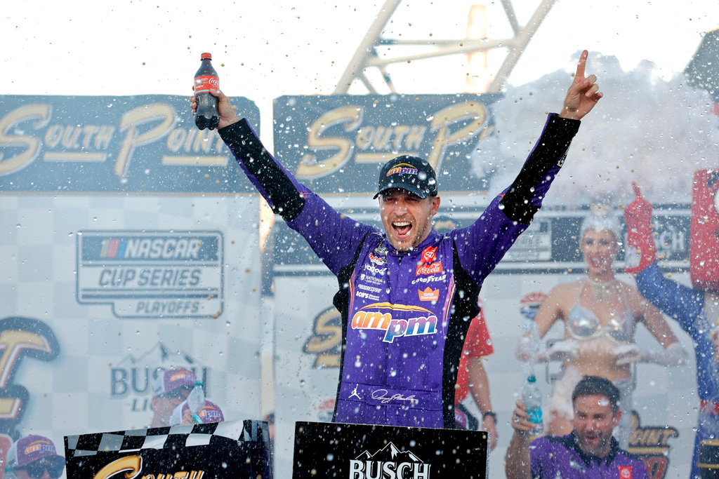 Denny Hamlin celebrates in victory lane after winning a NASCAR Cup Series auto race Sunday, Oct. 12, 2025, in Las Vegas. (AP Photo/Steve Marcus)
