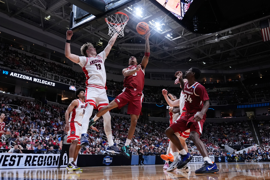 Arkansas guard Darius Acuff Jr. (5) shoots over Arizona center Motiejus Krivas (13) during the second half in the Sweet 16 of the NCAA college basketball tournament, Thursday, March 26, 2026, in San Jose, Calif. (AP Photo/Godofredo A. Vásquez)