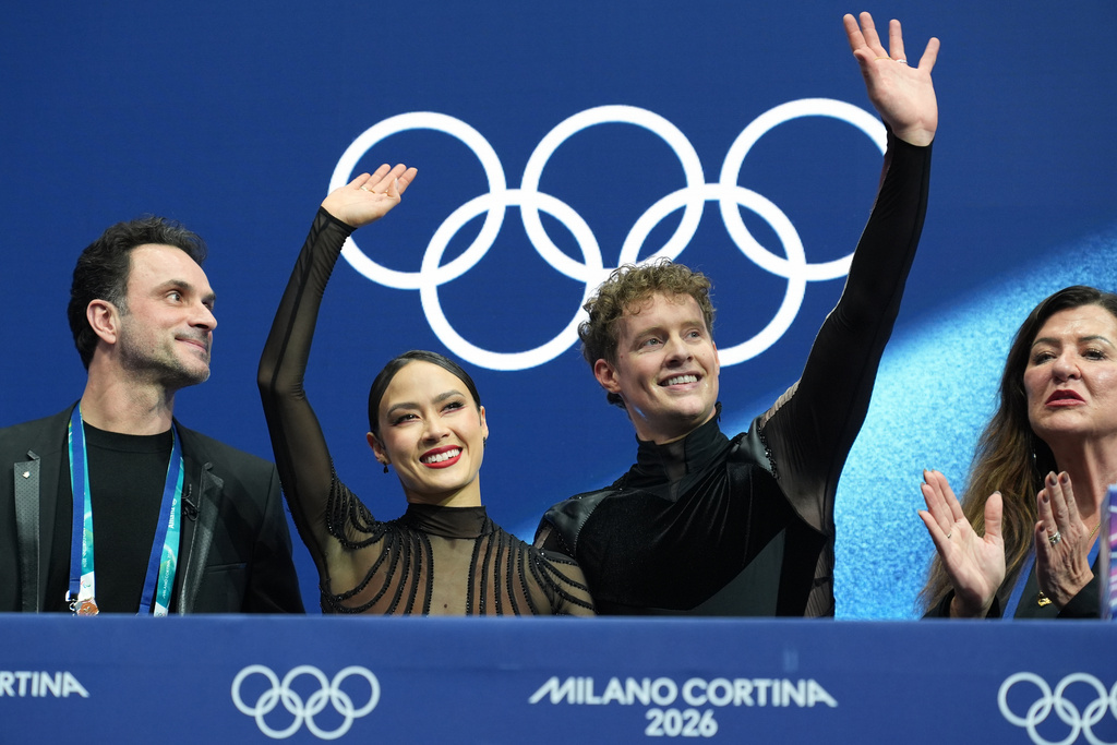 Madison Chock and Evan Bates of the United States react after competing during the ice dancing free skate in figure skating at the 2026 Winter Olympics, in Milan, Italy, Wednesday, Feb. 11, 2026. (AP Photo/Stephanie Scarbrough)