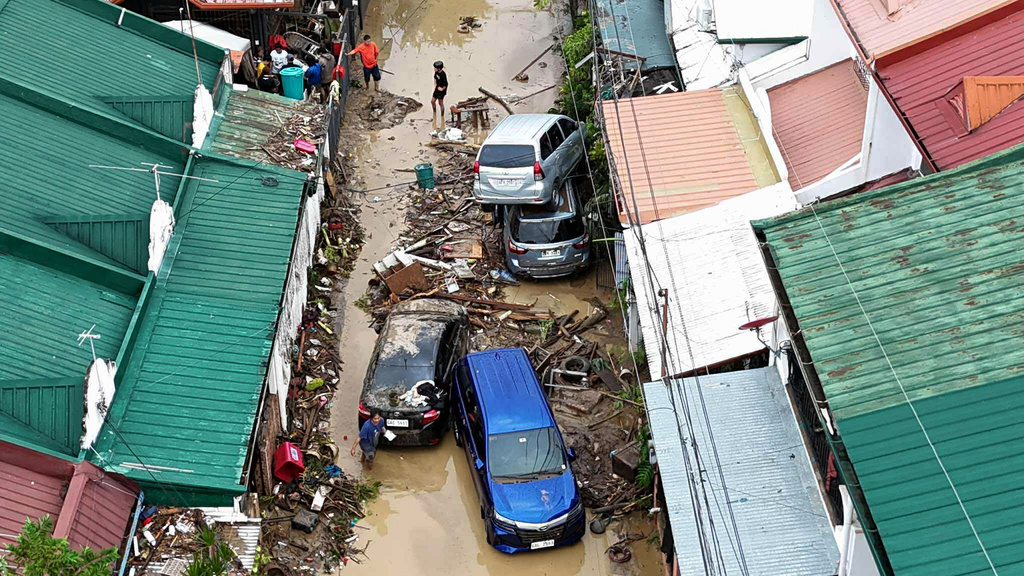 Cars are piled on top of each other after flooding caused by Typhoon Kalmaegi in Cebu city, central Philippines, Tuesday, Nov. 4, 2025. (AP Photo/Jacqueline Hernandez)