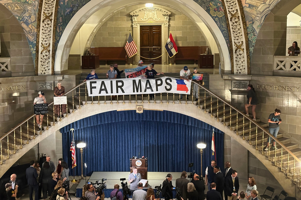 Opponents of Missouri's Republican-backed congressional redistricting plan display a banner in protest at the State Capitol in Jefferson City, Missouri, Sept. 10, 2025. (AP Photo/David A. Lieb)