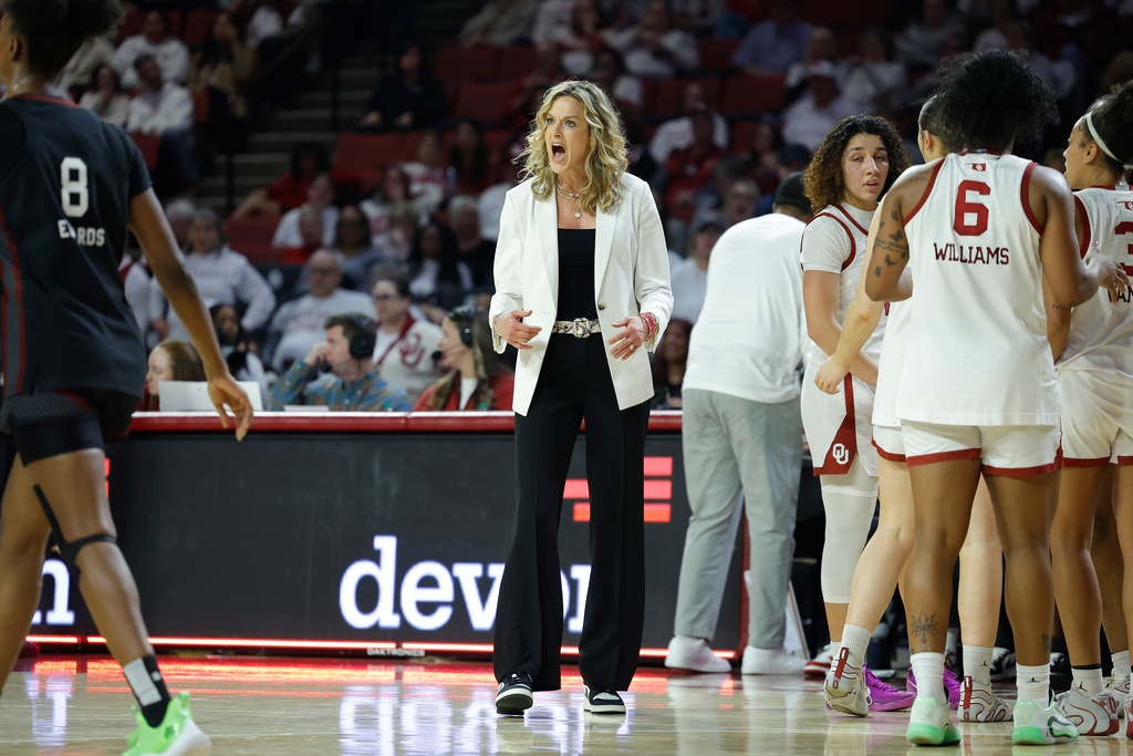 Oklahoma head coach Jennie Baranczyk talks during a time out against South Carolina during the first half of a NCAA college basketball game Thursday, Jan. 22, 2026, in Norman, Okla. (AP Photo/Alonzo Adams)