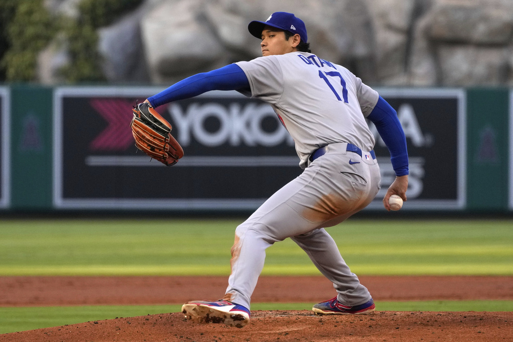 Los Angeles Dodgers starting pitcher Shohei Ohtani throws to the plate during the first inning of a baseball game against the Los Angeles Angels, Wednesday, Aug. 13, 2025, in Anaheim, Calif. (AP Photo/Mark J. Terrill)
