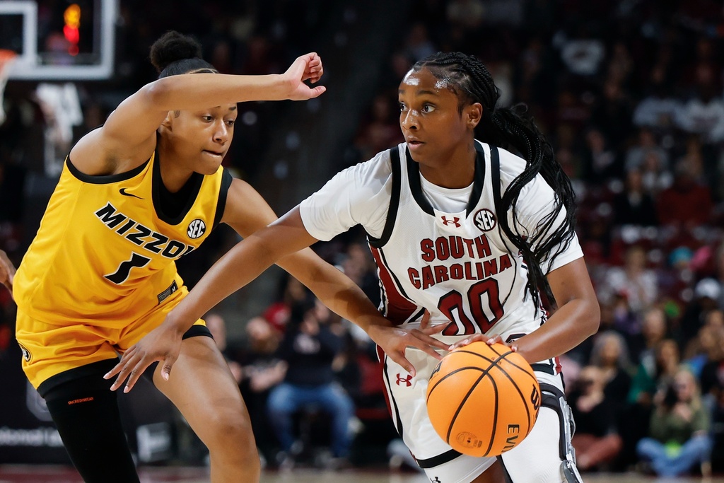 South Carolina guard Ta'niya Latson (00) drives to the basket against Missouri guard Shannon Dowell during the first half of an NCAA college basketball game in Columbia, S.C., Thursday, Feb. 26, 2026. (AP Photo/Nell Redmond)