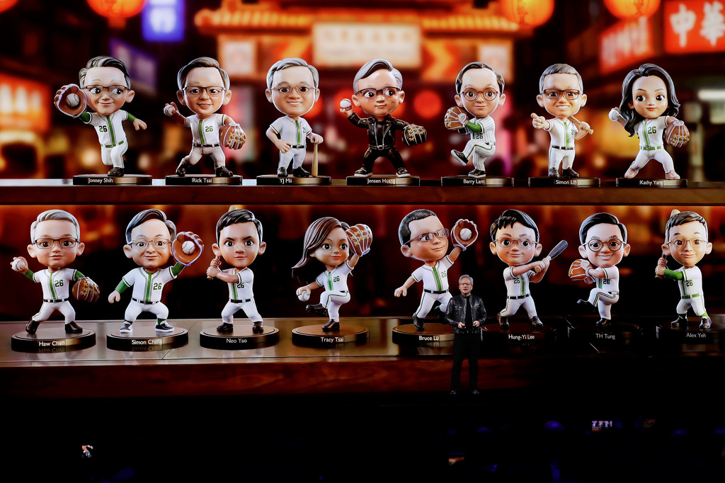 Nvidia CEO Jensen Huang, front, delivers a speech during the Computex 2026 exhibition in Taipei, Taiwan, Monday, June 1, 2026. (AP Photo/Chiang Ying-ying)