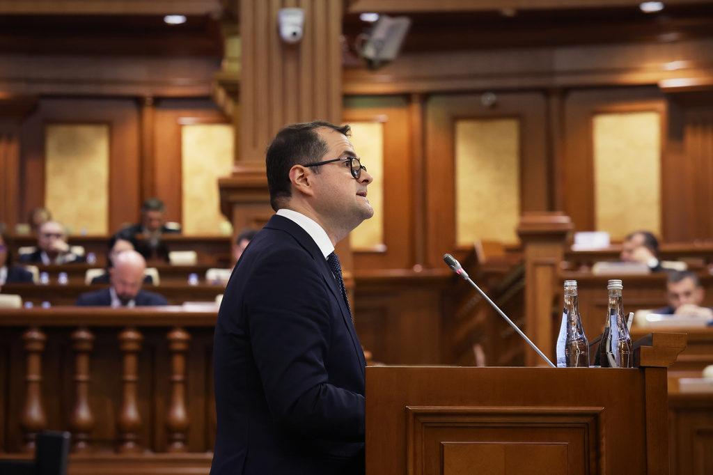 Prime Minister designate Vasile Tofan speaks before the parliament's confidence vote for the new government team in Chisinau, Moldova, Tuesday, July 21, 2026. (AP Photo/Aurel Obreja)