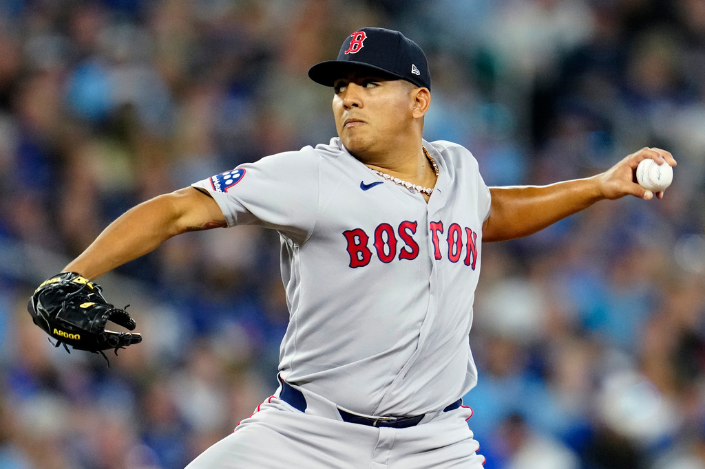 Boston Red Sox pitcher Ranger Suarez works against the Toronto Blue Jays during first-inning baseball game action in Toronto, Monday, April 27, 2026. (Frank Gunn/The Canadian Press via AP)