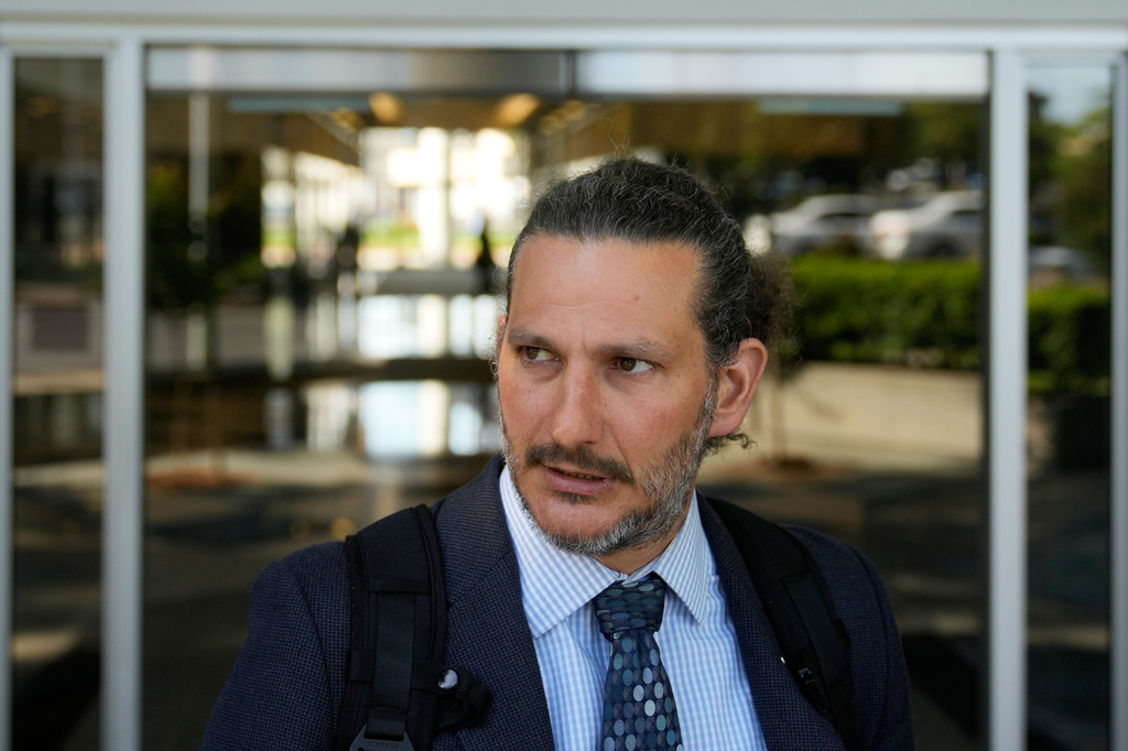 Attorney Judah Lakin is interviewed outside of Immigration Court Tuesday, May 12, 2026, in Concord, Calif. (AP Photo/Jeff Chiu)