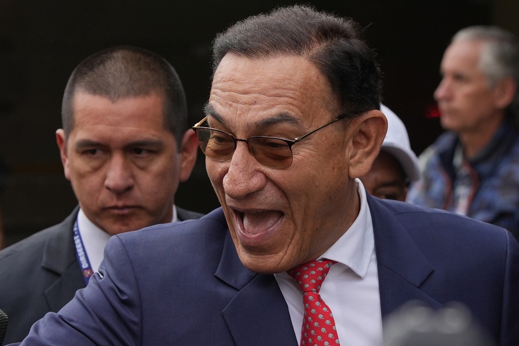 Former President Martin Vizcarra, who faces corruption charges, arrives for a sentence hearing in Lima, Peru, Wednesday, Nov. 26, 2025. (AP Photo/Guadalupe Pardo)