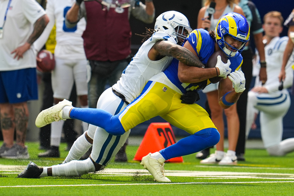 Los Angeles Rams wide receiver Puka Nacua (12) makes a catch in front of Indianapolis Colts cornerback Xavien Howard (4) during the first hall of an NFL football game Sunday, Sept. 28, 2025, in Inglewood, Calif. (AP Photo/Marcio Jose Sanchez)
