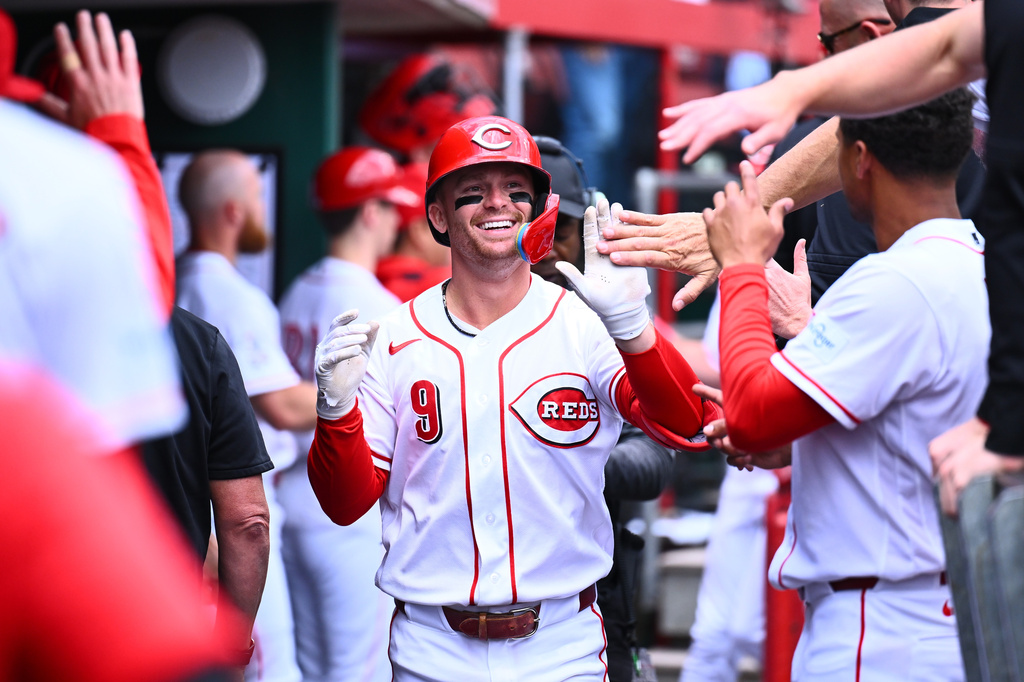 Cincinnati Reds' Matt McLain (9) celebrates his two-run home run with his teammates during the second inning of a baseball game against the Washington Nationals in Cincinnati, Thursday, May 14, 2026. (AP Photo/Ben Jackson)