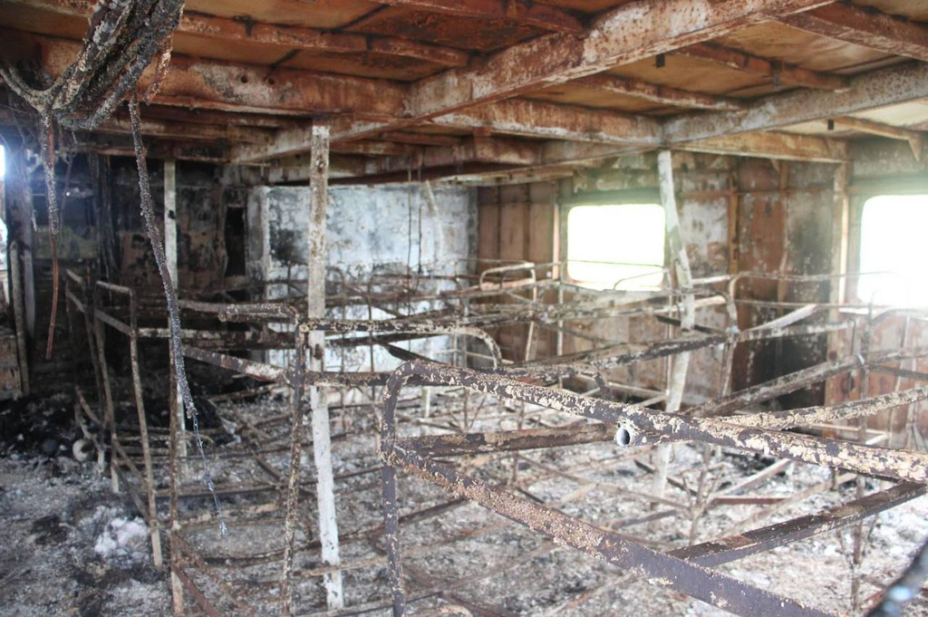 This photo provided by the Philippine Coast Guard shows damages on the ferry MV June Aster off Coron, Palawan province, western Philippines, Friday, Sept. 11, 2026, days after it caught fire.(Philippine Coast Guard via AP)