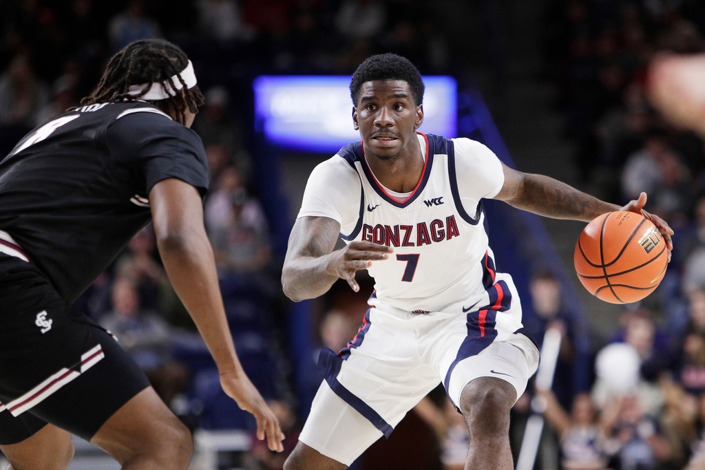 Gonzaga guard Tyon Grant-Foster (7) controls the ball while pressured by Santa Clara forward Elijah Mahi during the first half of an NCAA college basketball game, Thursday, Jan. 8, 2026, in Spokane, Wash. (AP Photo/Young Kwak)