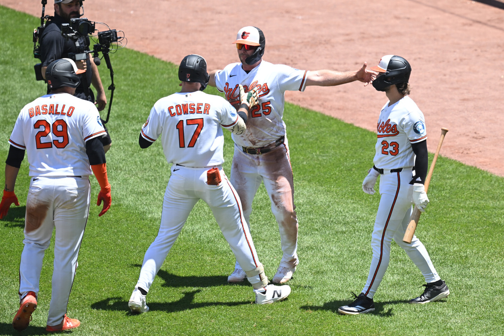 Baltimore Orioles center fielder Colton Cowser (17) is greeted by Baltimore Orioles first baseman Pete Alonso (25) after hitting a three run homer against the Toronto Blue Jays during the third inning of a baseball game, Sunday, May 31, 2026 in Baltimore. Baltimore Orioles catcher Samuel Basallo (29) also scored on the play. (AP Photo/Gail Burton)