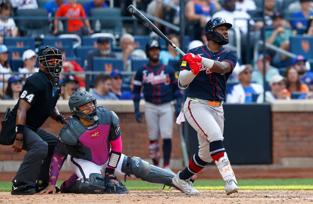 Atlanta Braves' Michael Harris II follows through on a home run during the eighth inning of a baseball game against the New York Mets, Saturday, June 13, 2026, in New York. (AP Photo/Noah K. Murray)