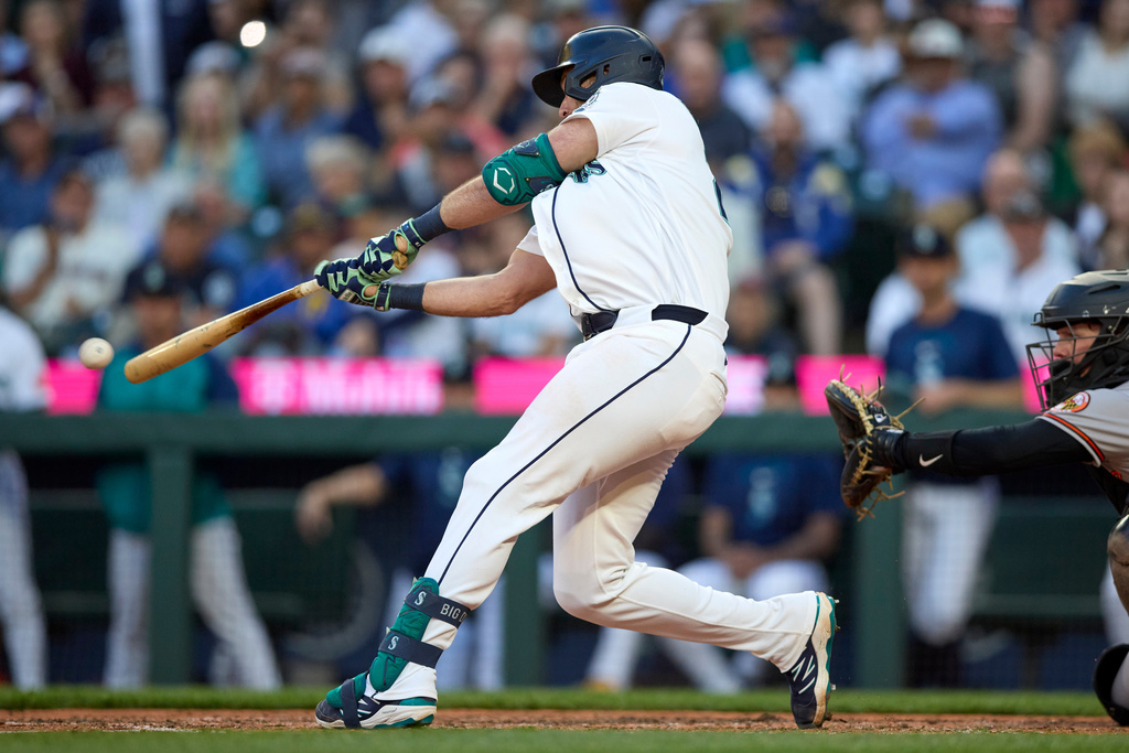 Seattle Mariners' Cal Raleigh hits a two-run single during the seventh inning in a baseball game against the Baltimore Orioles, Tuesday, June 16, 2026, in Seattle. (AP Photo/John Froschauer)