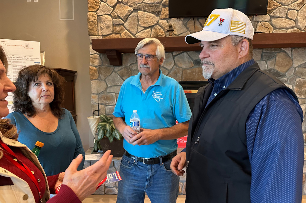 David Flippo, right, a Republican candidate for Congress in Nevada's 2nd district, speaks to attendees of a campaign event in Genoa, Nev., Tuesday, May 19, 2026. (AP Photo/Jessica Hill)