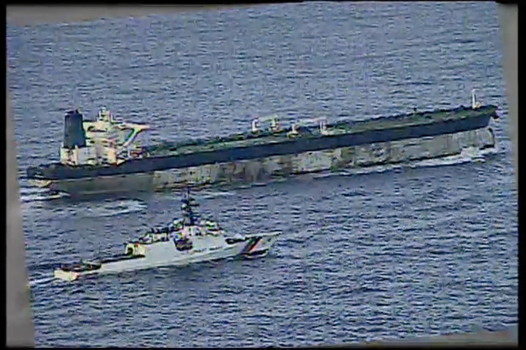 This image from video provided by the U.S. Department of Defense, shows the U.S. Coast Guard cutter Munro shadowing the MV Bella 1 in the North Atlantic Ocean during the maritime interdiction operation Wednesday, Jan. 7, 2026. (Department of Defense via AP)