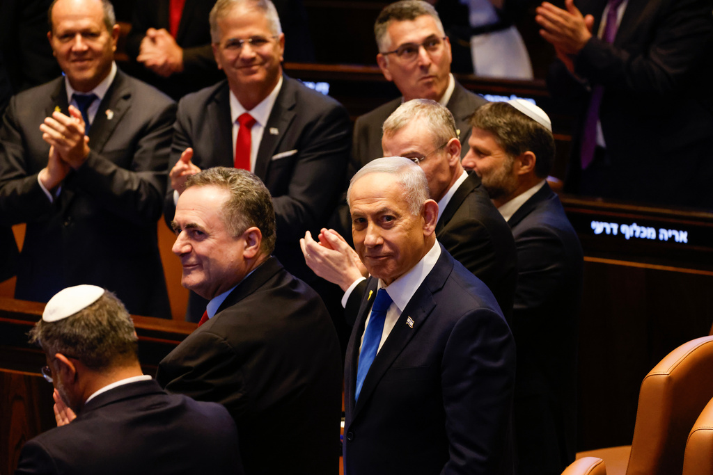 Israeli Prime Minister Benjamin Netanyahu looks on while President Donald Trump addresses the Knesset, Israel's parliament, Monday, Oct. 13, 2025, in Jerusalem. (Jalaa Marey/Pool Photo via AP)