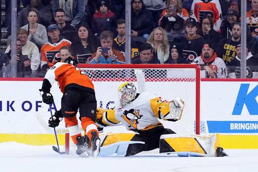 Philadelphia Flyers' Bobby Brink, left, scores a goal against Pittsburgh Penguins' Arturs Silovs during a shootout in an NHL hockey game, Tuesday, Oct. 28, 2025, in Philadelphia. (AP Photo/Matt Slocum) Philadelphia Flyers' Bobby Brink, left, scores a goal against Pittsburgh Penguins' Arturs Silovs during a shootout in an NHL hockey game, Tuesday, Oct. 28, 2025, in Philadelphia. (AP Photo/Matt Slocum)