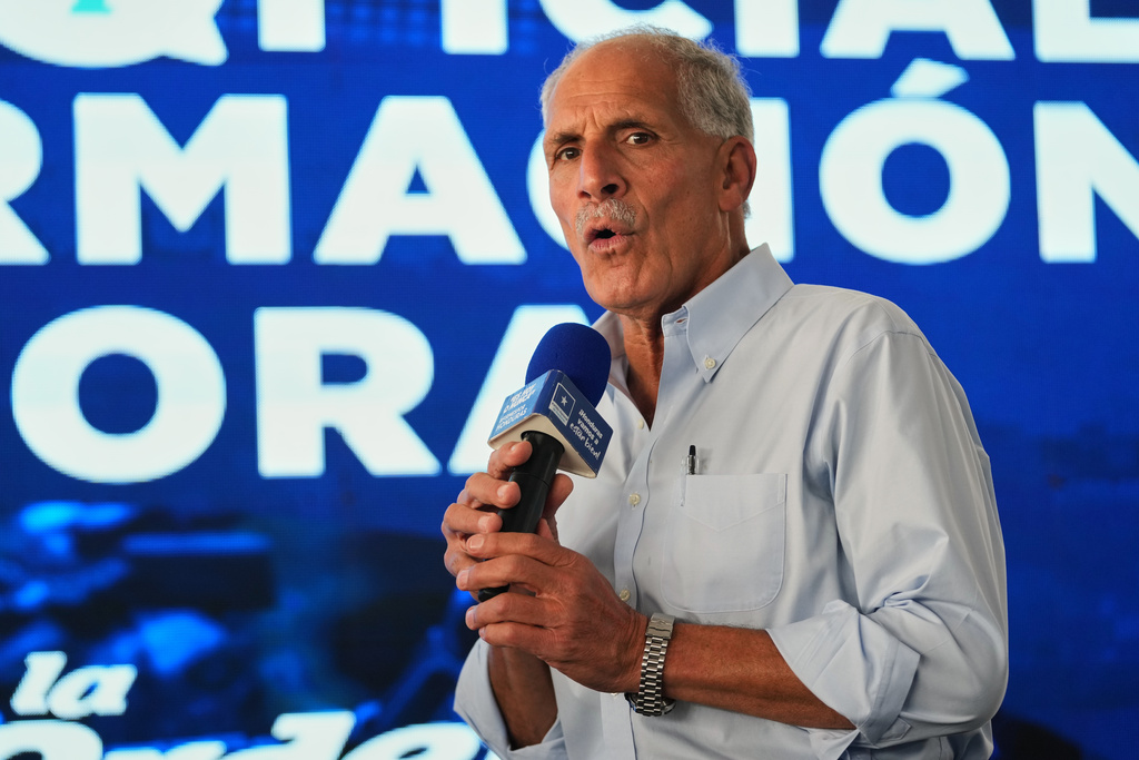 Presidential candidate Nasry Asfura, of the National Party, gives a press conference in Tegucigalpa, Honduras, Monday, Dec. 1, 2025. (AP Photo/Moises Castillo)