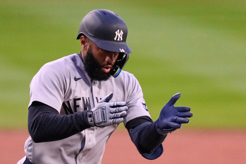 New York Yankees' Amed Rosario celebrates after his three run home run in the first inning off Boston Red Sox pitcher Ranger Suarez during a baseball game at Fenway Park, Wednesday, April 22, 2026, in Boston. (AP Photo/Charles Krupa)