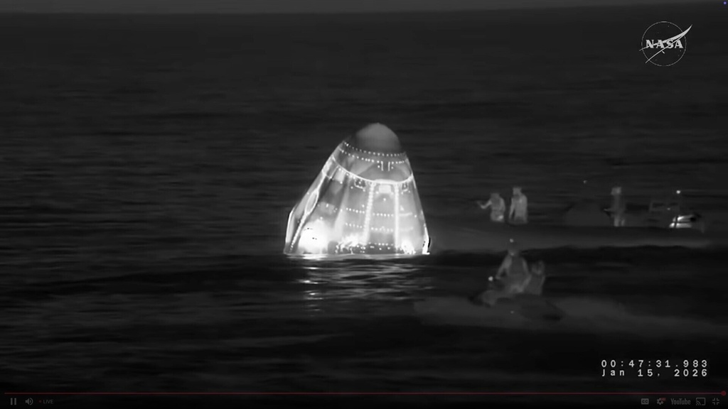 This screengrab from video provided by NASA shows recovery vessels approaching the NASA's SpaceX Crew-11 capsule to evacuate one of the crew members after they re-entered the earth in a middle-of-the-night splashdown near San Diego, Calif., Thursday, Jan. 15, 2026. (NASA via AP)
