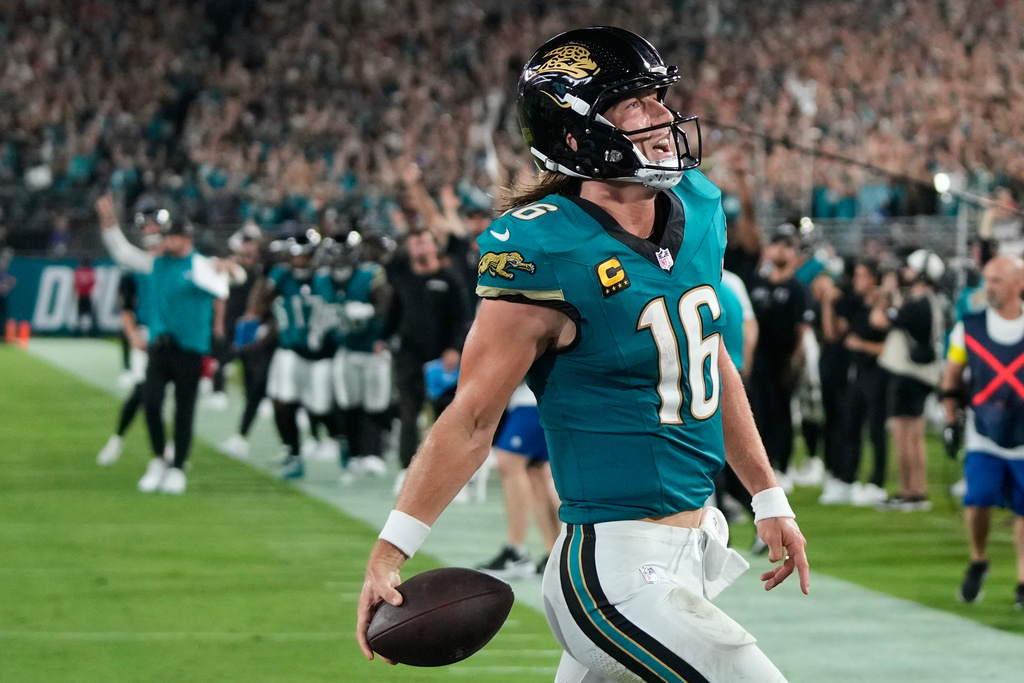 Jacksonville Jaguars quarterback Trevor Lawrence celebrates after scoring a touchdown during the second half of an NFL football game against the Kansas City Chiefs, Monday, Oct. 6, 2025, in Jacksonville, Fla. (AP Photo/John Raoux)