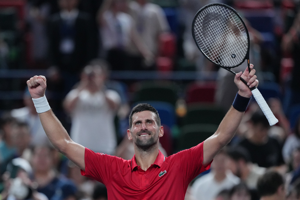 Novak Djokovic, of Serbia celebrates after defeating Jaume Munar, of Spain in the men's singles match of the Shanghai Masters tennis tournament at Qizhong Forest Sports City Tennis Center, in Shanghai, China, Tuesday, Oct. 7, 2025. (AP Photo/Andy Wong)