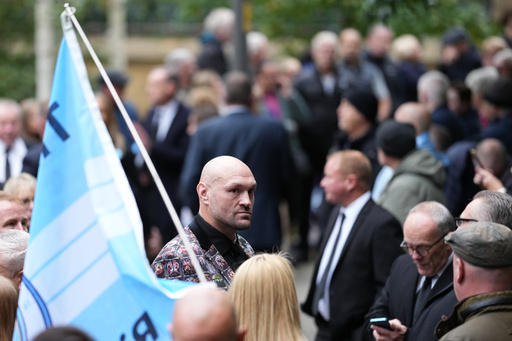 Boxer Tyson Fury, centre, attends the funeral of boxer Ricky Hatton, in Manchester, England, Friday, Oct. 10, 2025. (AP Photo/Jon Super) Boxer Tyson Fury, centre, attends the funeral of boxer Ricky Hatton, in Manchester, England, Friday, Oct. 10, 2025. (AP Photo/Jon Super)