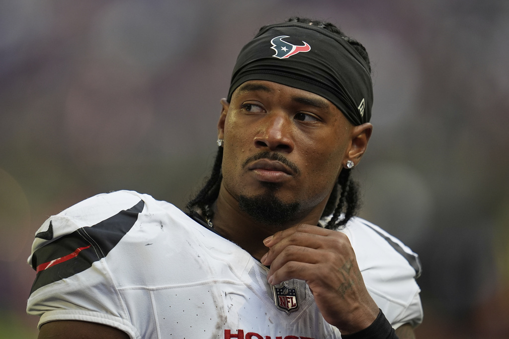 FILE - Houston Texans wide receiver John Metchie III leaves the field after an NFL preseason football game against the Minnesota Vikings, Aug. 9, 2025, in Minneapolis. (AP Photo/Abbie Parr, fILE)