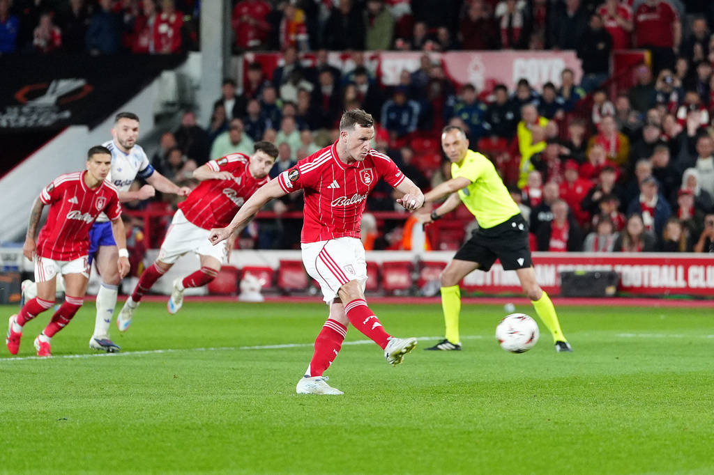 Nottingham Forest's Chris Wood scores their side's first goal from a penalty during the Europa League semifinal first leg soccer match between Nottingham Forest and Aston Villa in Nottingham, England, Thursday, April 30, 2026. (David Davies/PA via AP)