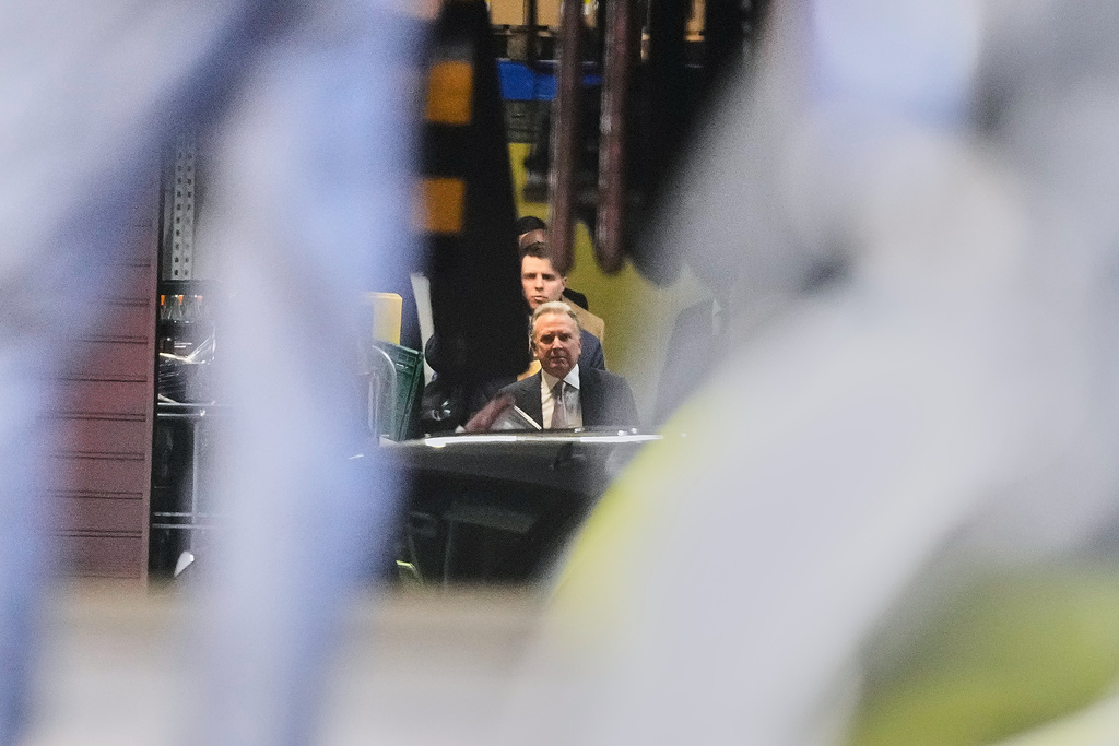 Steve Witkoff, special envoy of the United States, leaves through a hotel garage for talks between representatives of the U.S. and Ukraine in Berlin, Germany, Sunday, Dec. 14, 2025. (AP Photo/Markus Schreiber)