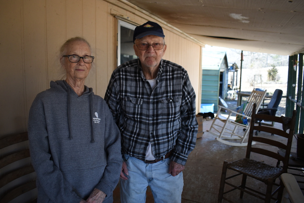 Barbara Bishop, 79, left, and her husband George Bishop, 85, pose for a portrait on their front porch, Friday, Feb. 6, 2026 in Oxford, Ms. (AP Photo/Sophie Bates)