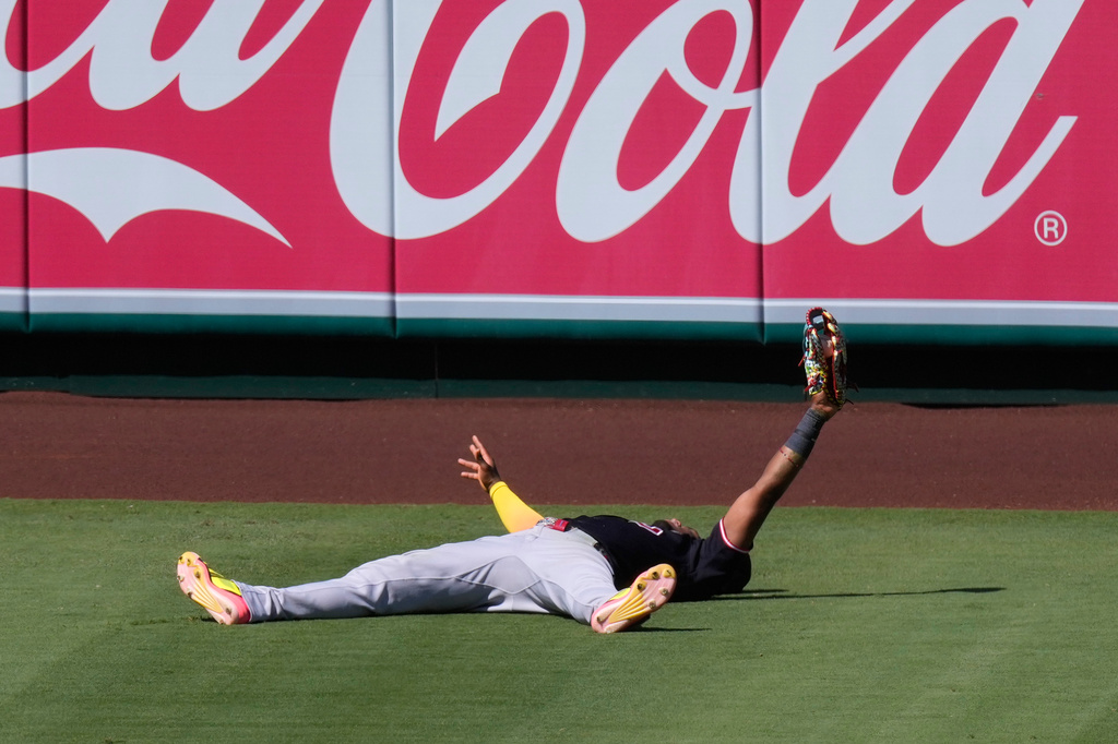 Cleveland Guardians left fielder Angel Martínez gestures after making a catch on a ball hit by Los Angeles Angels' Zach Neto during the seventh inning of a baseball game Wednesday, Aug. 26, 2026, in Anaheim, Calif. (AP Photo/Mark J. Terrill)