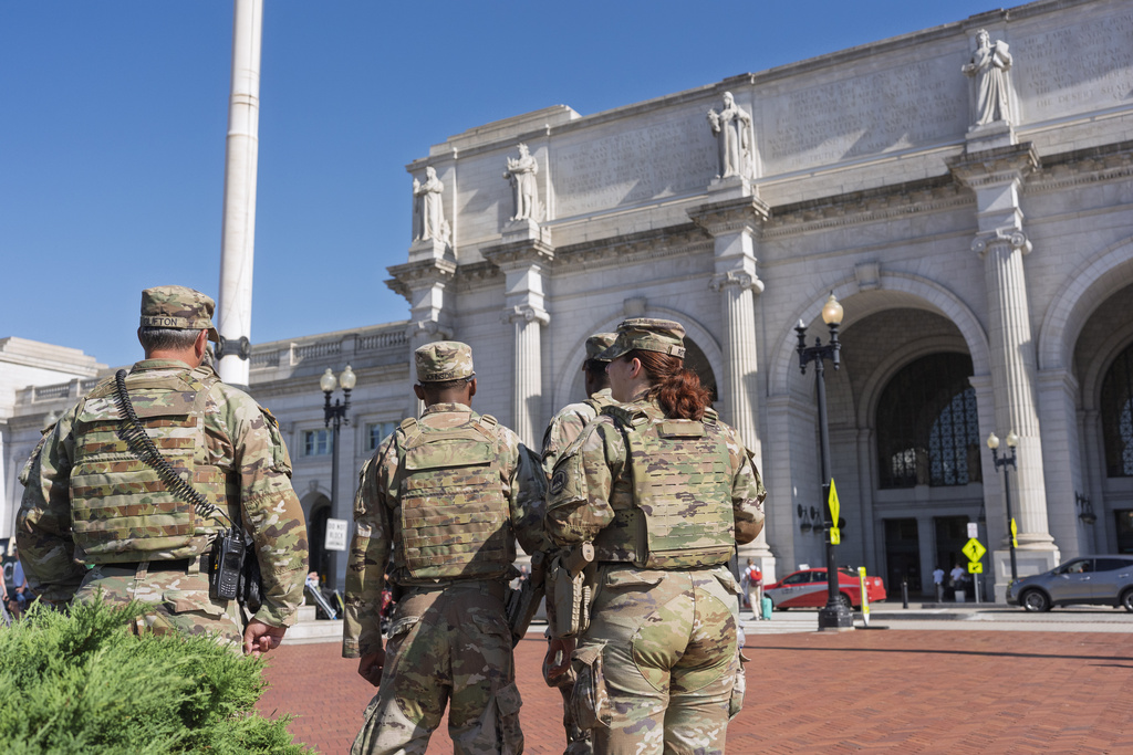 Members of the National Guard are posted at Union Station in Washington, Wednesday, Aug. 27, 2025. (AP Photo/J. Scott Applewhite)